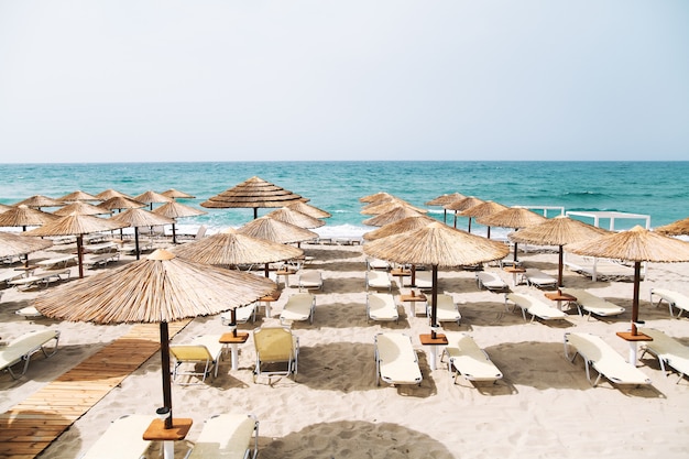 Vacation background.Beach with umbrellas and sea view.