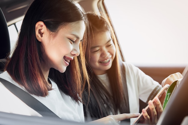 Vacation time and travel, three beautiful young women cheerful travels.