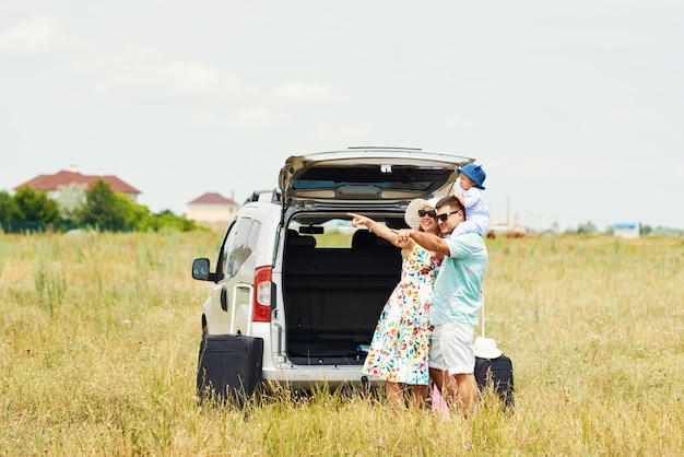 Vacation, Travel - happy family ready for the travel for summer vacation. People have fun and take pictures on the phone. Take a selfie on the memory of the journey	