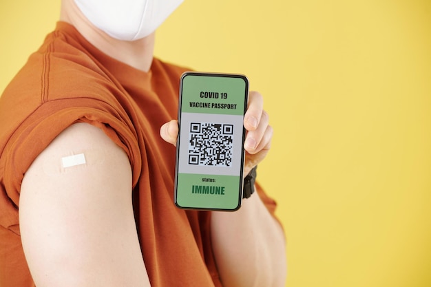 Vaccinated Man Showing QR code