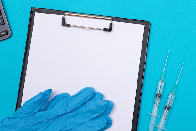 Vaccination or revaccination concept  two medical syringe on blue table