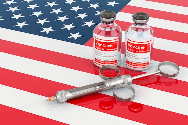 Vaccination in the USA concept Vaccine bottles with syringe on the American flag 3D rendering