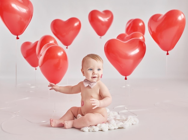 Valentine Baby boy with kiss on cheek Valentine's Day Balls and flowers Celebration Mother's day postcard International day of happiness Birthday party