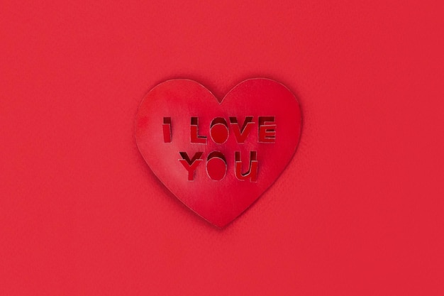 Valentine card shape heart with cut out inscription I love you red