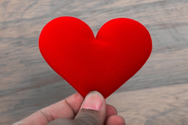 valentine day background, hand hold love red heart close up