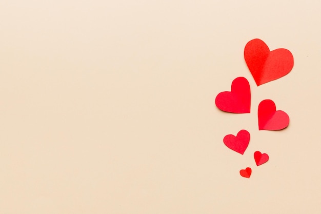 Valentine day background with red hearts top view with copy space