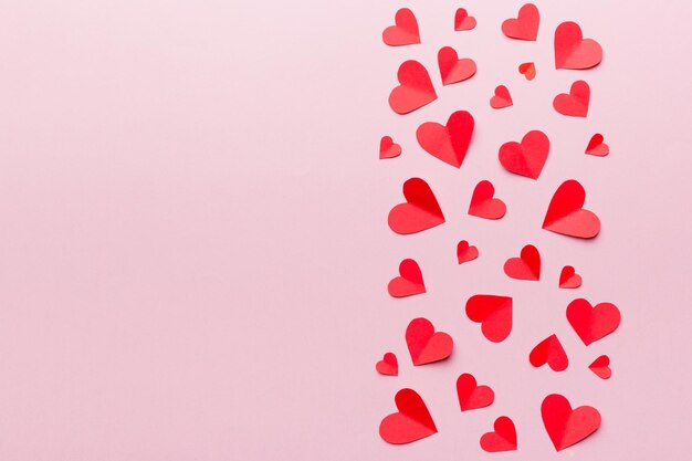 Valentine day background with red hearts top view with copy space