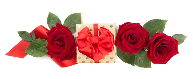 Valentine day gift box with red silk ribbon bow rose flowers and hearts isolated on white background love concept