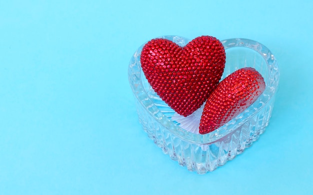 Valentine day. Red heart on the blue boards. Valentine's Day. Heart pendant. Red heart. Space for text. Eighth of March. International Women's Day. Toned image.