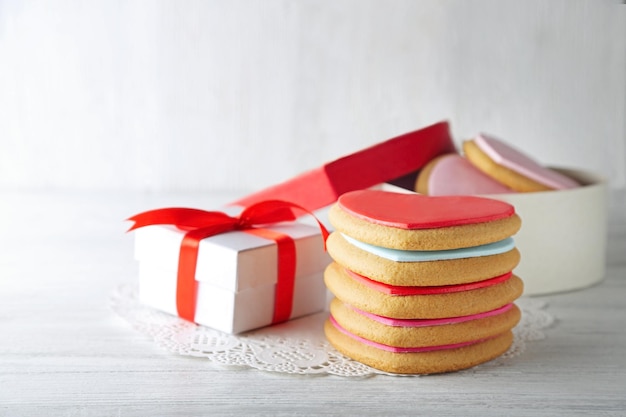 Valentine heart cookies in present box on wooden background