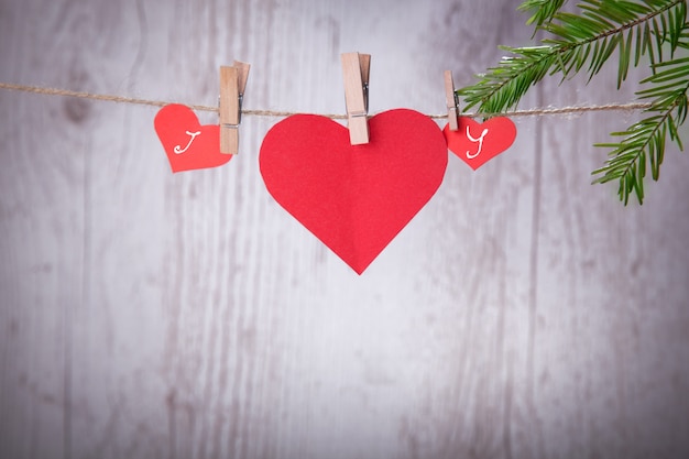 Photo valentine hearts with handmade angels, a good congratulatory card.