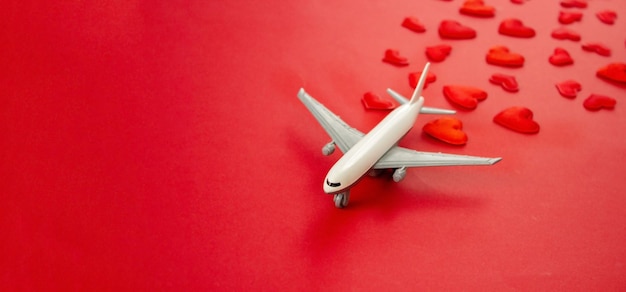 Valentine's card, beautiful red background with airplanes. Selective focus. Love.