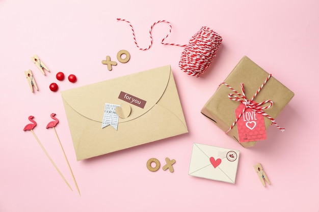 Valentine's Day accessories on pink background, top view