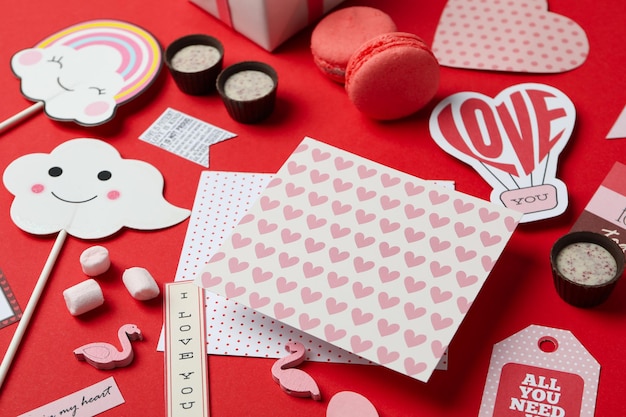 Valentine's Day accessories on red background, close up