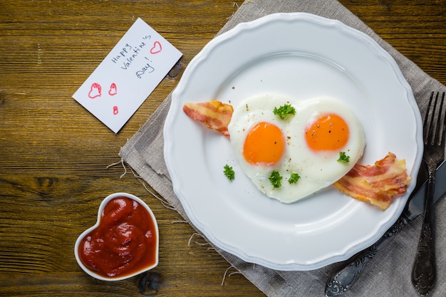 Valentine's day breakfast - eggs, bacon, ketchup