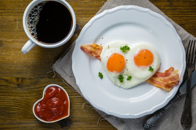 Valentine's day breakfast - eggs, bacon, ketchup