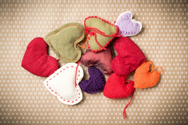 Valentine's Day. Colorful knitted hearts on a vintage in polka dots. Red heart.