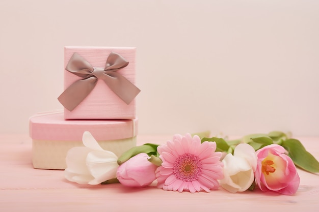 Valentine's day composition pink gift box with flowers.