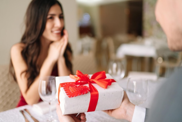 Valentine's Day concept Happy couple in love with Couple celebrating Valentine's Day in restaurant