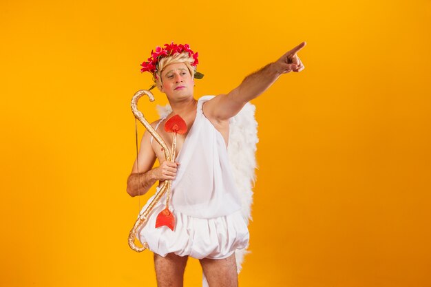 Valentine's day concept. Portrait of the God of love - Cupid with bow and arrow.