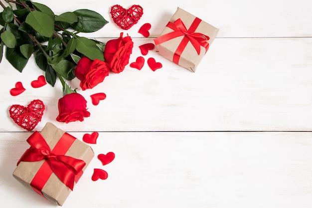 Valentine's day concept Red roses hearts and gift boxes on white background Mockup place for text