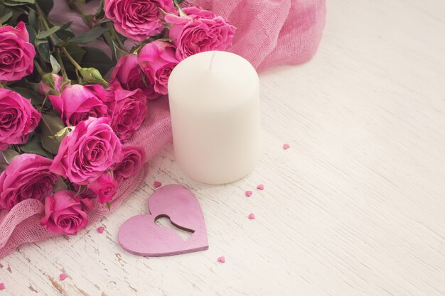 Valentine's day concept with heart, candle and roses