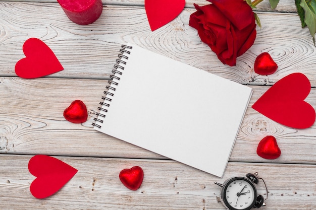 Valentine's day. Empty blank notebook, gift box, flowers