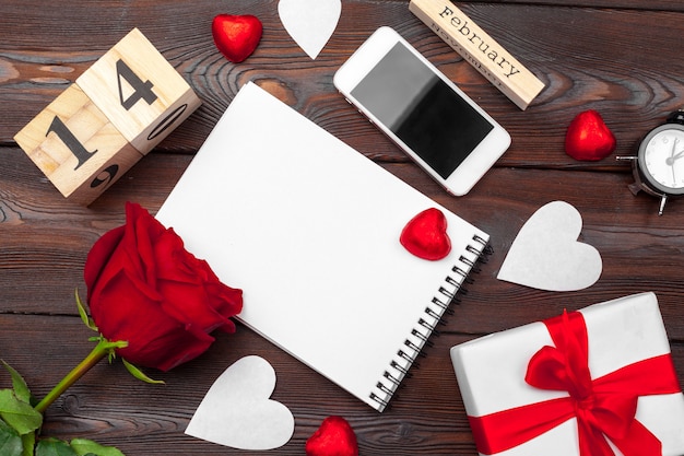 Valentine's day. Empty blank notebook, gift box, flowers