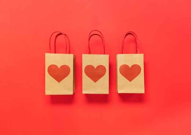 Valentine's day gift box and hearts on red background