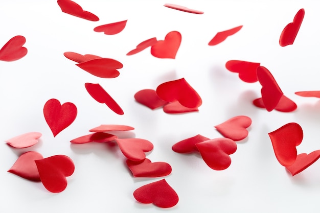 Valentine's day and wedding day, background of falling red satin hearts.