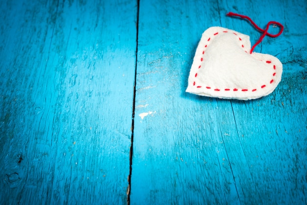 Valentine's Day. White heart on the blue boards. Valentines day. Heart pendant. Valentine cards.