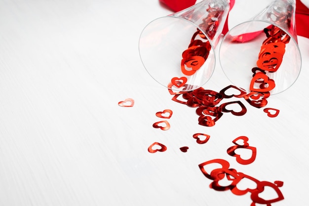 Valentine's dayromance love hearts spilling out of champagne glasses