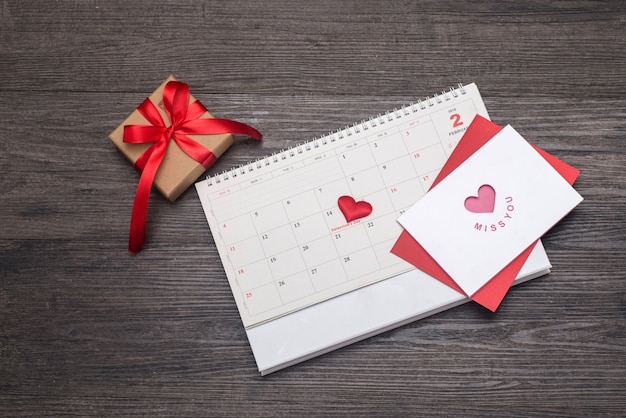 Valentines day background, card and gift on the calendar