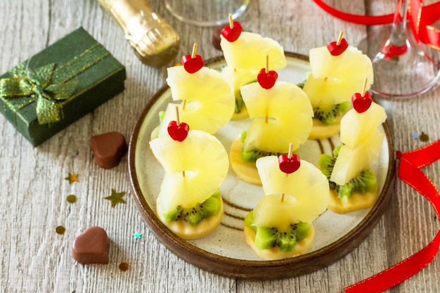 Valentines day or birthday romantic antipasto Canapes with cheese kiwi and pineapple