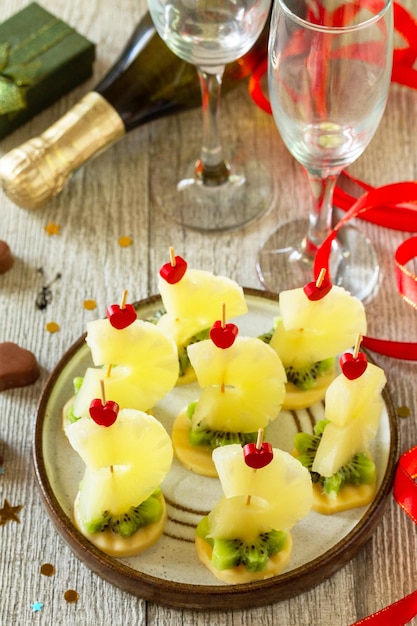 Valentines day or birthday romantic antipasto Canapes with cheese kiwi and pineapple