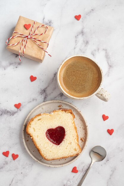 Valentines day breakfast with heart cake and coffee