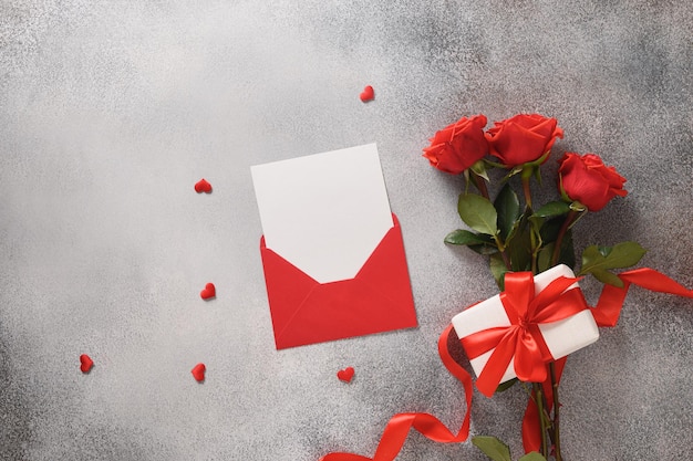 Valentines day card with romantic gift red roses