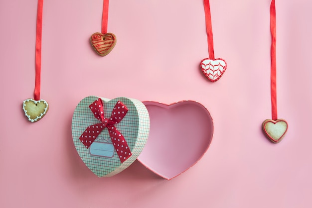 Valentines day dinner on pink background. View from above.