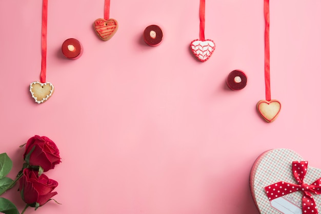 Valentines day dinner on pink background. View from above.