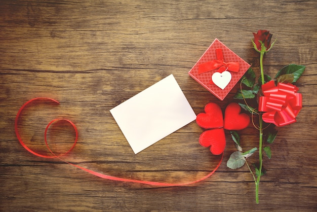 Valentines day gift box red on wood card rose flower and gift box ribbon bow - Envelope love mail Valentine Letter