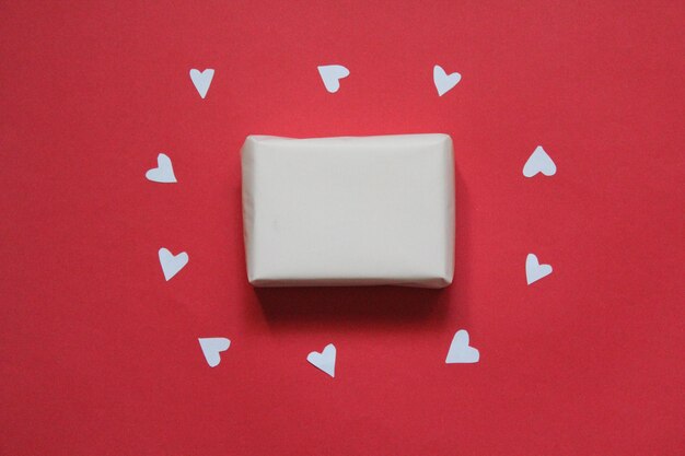 Valentines Day Gifts hearts on red background Flat lay top view copy space