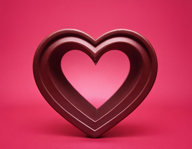 Valentines Day Heart Made of Red Roses Isolated on pink Background generated ai