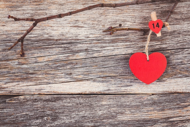 Valentines day red hearts over wooden background. Toned, soft focus, copy space