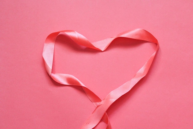 Valentines Day Ribbon hearts on pink background Flat lay top view copy space