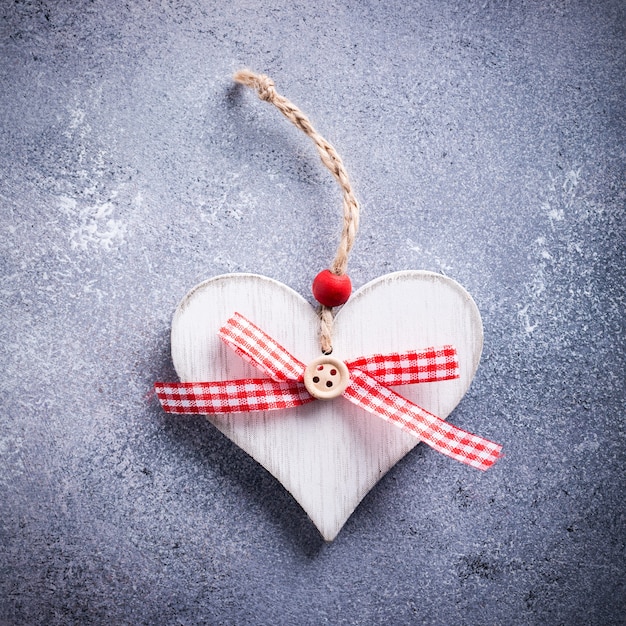 Valentines Day surface with decorative wooden heart on concrete stone with copy space for text. Valentine's Day concept. View from above