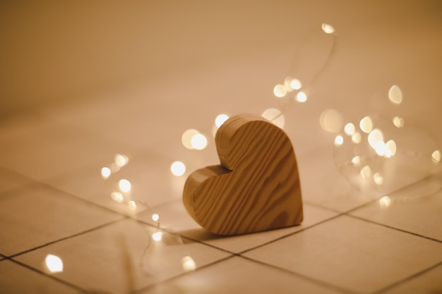 Valentines Day Wedding concept Wooden Heart by defocused blurred lights