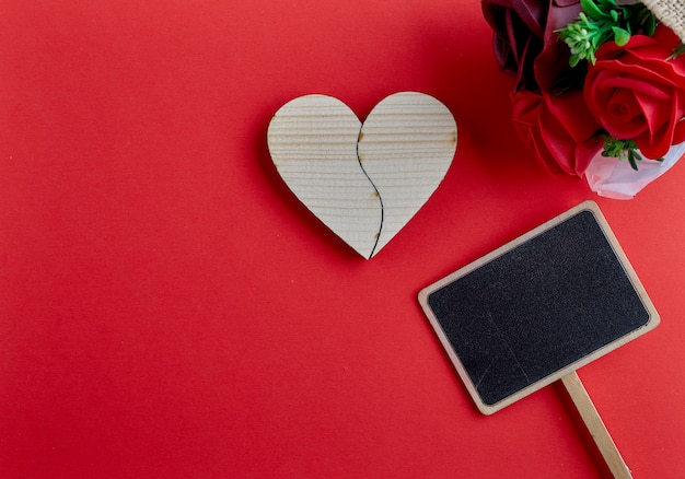 Valentines day wooden heart on red background