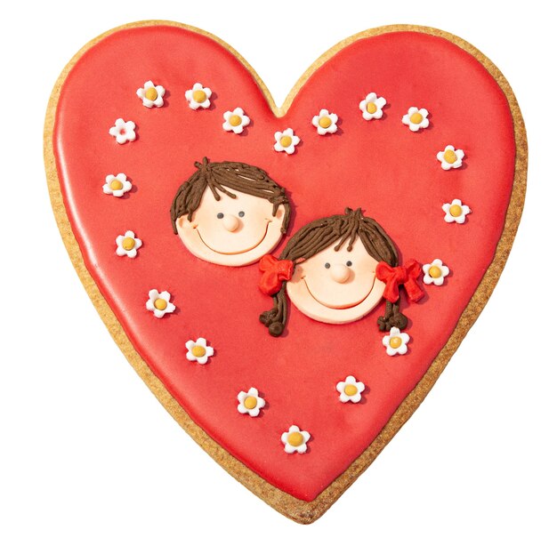 Photo valentines red heart cookie decorated with boy and girl head isolated on white background