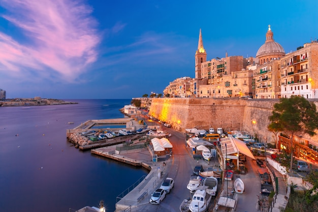 Valletta Skyline with church of Our Lady of Mount Carmel and St. Paul's Anglican Pro-Cathedral, at beautiful sunset, Valletta, Capital city of Malta