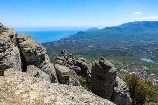 The Valley of Ghosts. Demerji. Green trees and bushes in the foreground. Crimea.